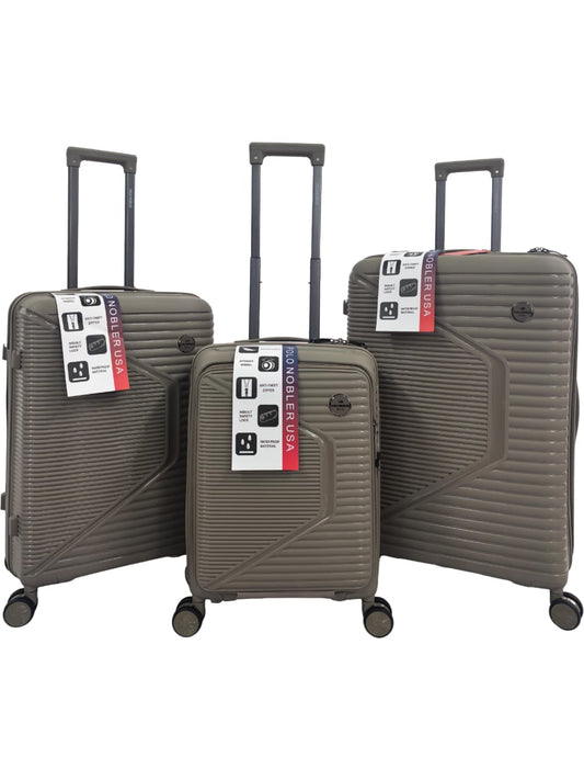 Three champagne suitcases with visible tags on a white background