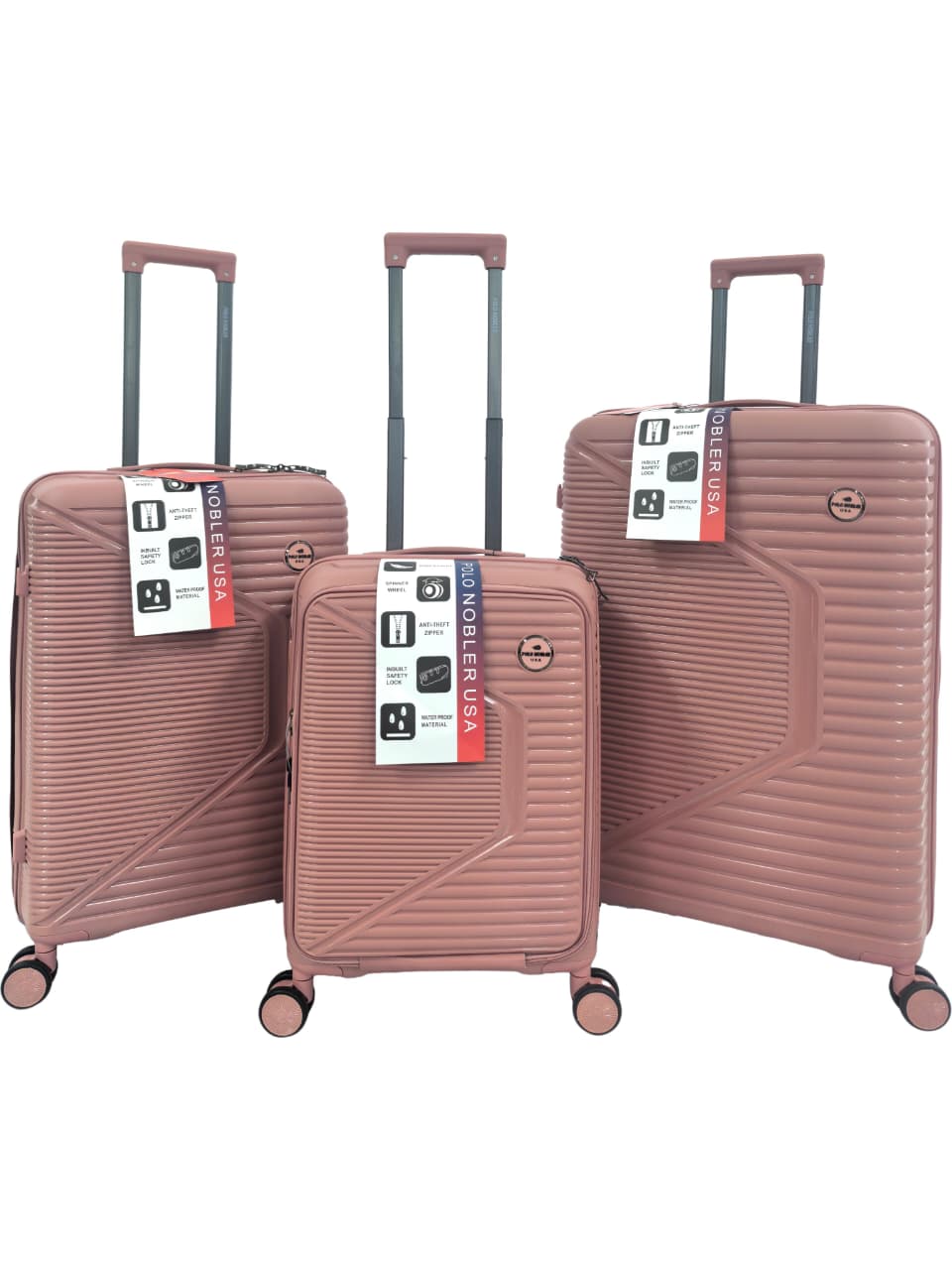 Set of three pink suitcases with visible brand labels on a white background